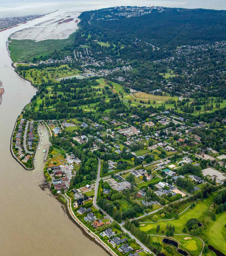 Aerial view of the property with water views