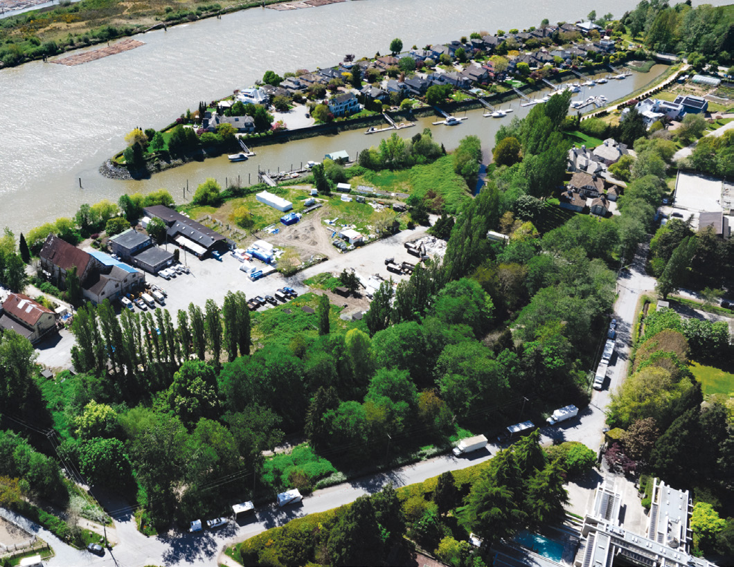 Aerial view of the waterfront property showing the Fraser River